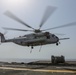 Helicopter support team transports AV-8B Harrier engine from USS Bataan