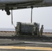 Helicopter support team transports AV-8B Harrier engine from USS Bataan