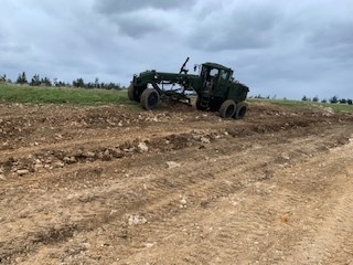 U.S. Navy Seabees with NMCB-5 resurface a runway at Ie Shima Training Facility