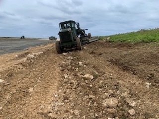 U.S. Navy Seabees with NMCB-5 resurface a runway at Ie Shima Training Facility