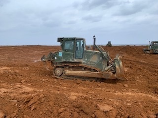 U.S. Navy Seabees with NMCB-5 resurface a runway at Ie Shima Training Facility
