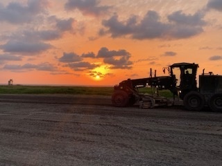U.S. Navy Seabees with NMCB-5 resurface a runway at Ie Shima Training Facility