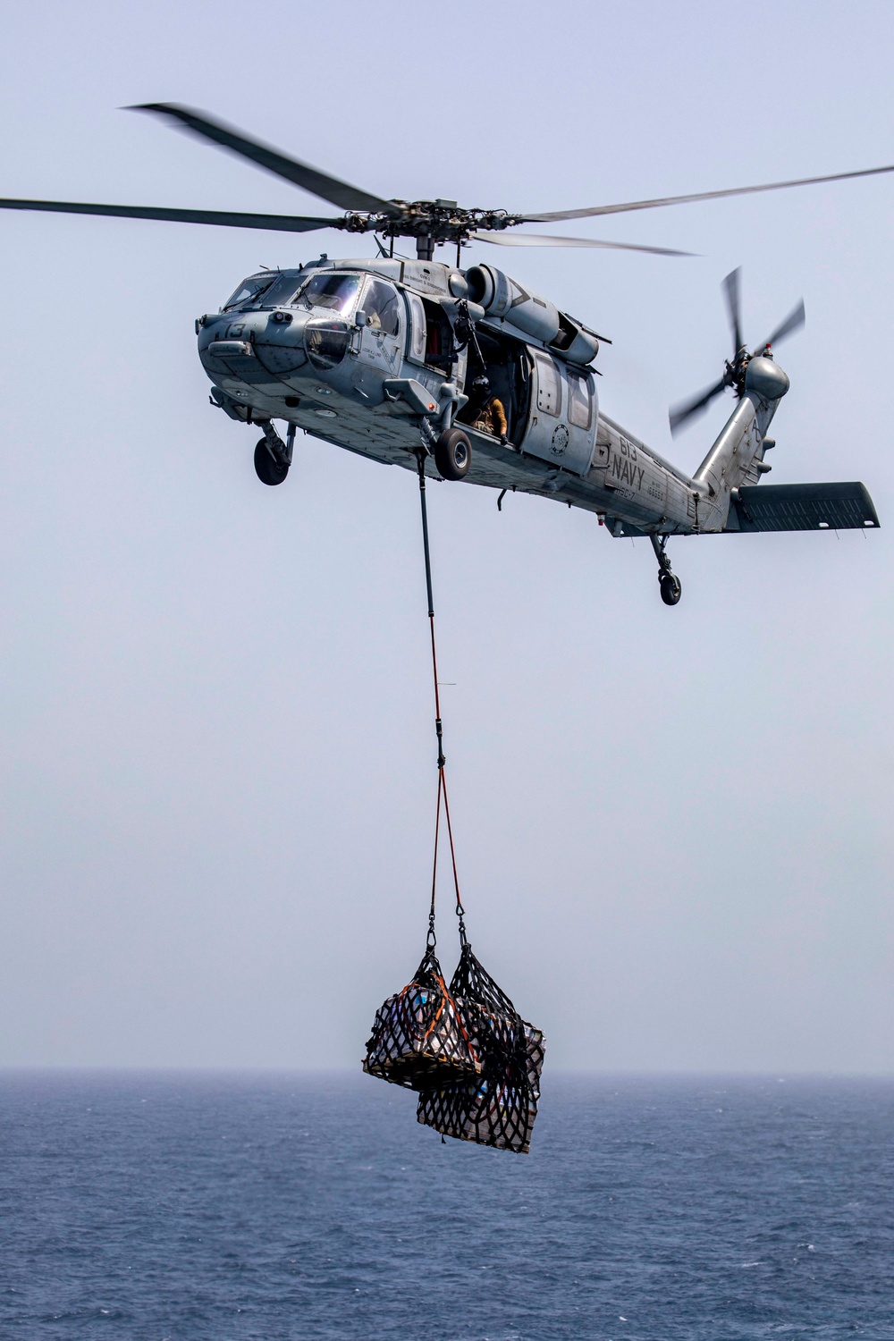 Sailors and Marines take part in a replenishment-at-sea