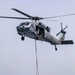 Sailors and Marines take part in a replenishment-at-sea