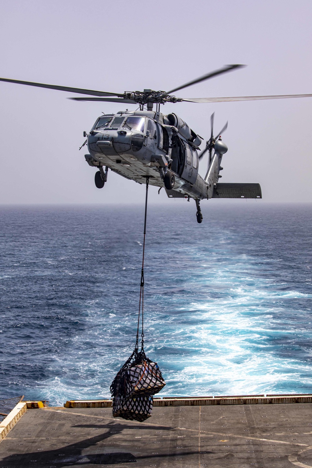 Sailors and Marines take part in a replenishment-at-sea