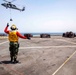 Sailors and Marines take part in a replenishment-at-sea