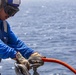 Sailors and Marines take part in a replenishment-at-sea