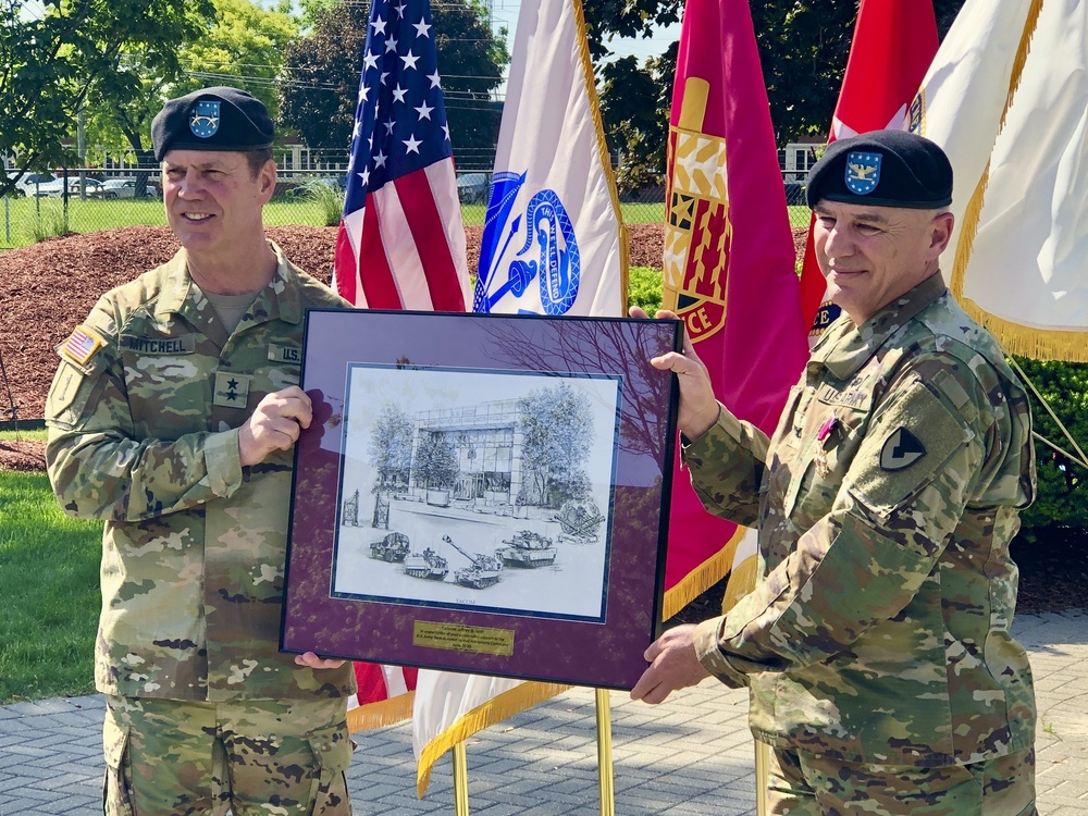 Maj. Gen. Dan Mitchell presents gift to Col. Jeffrey Witt at retirement