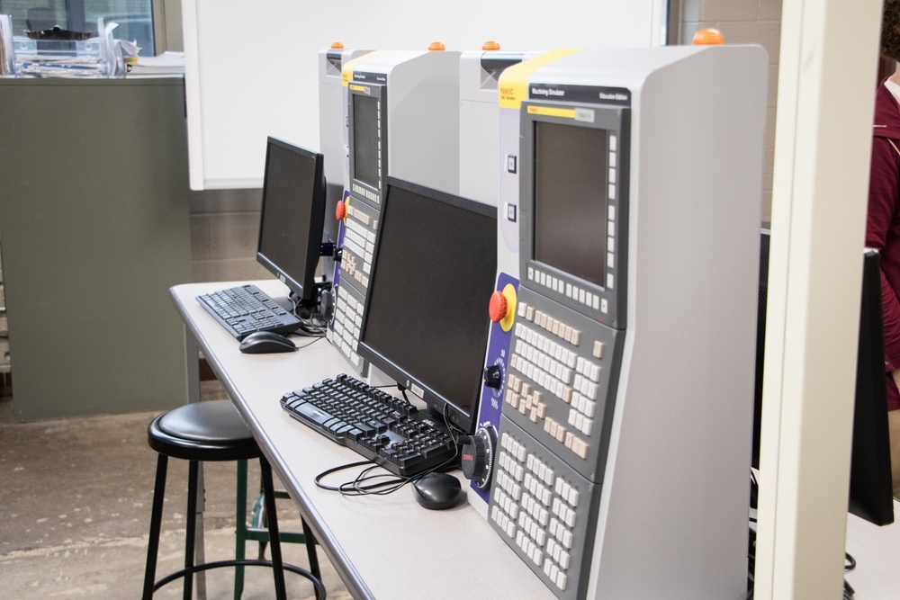 RIA factory team tours high school CNC program lab