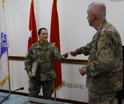 Coin Presentation to Sustainer of the Week [Image 1 of 3]