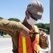 Seabees assigned to Naval Mobile Construction Battalion (NMCB) wire a pole during a street lighting construction project on aboard Naval Station Rota, Spain.