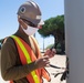 Seabees assigned to Naval Mobile Construction Battalion (NMCB) wire a pole during a street lighting construction project on aboard Naval Station Rota, Spain.