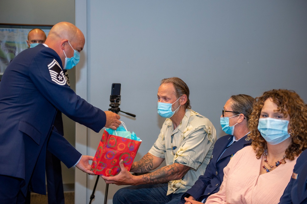 Presenting gift to husband on behalf of new Wing Command Chief