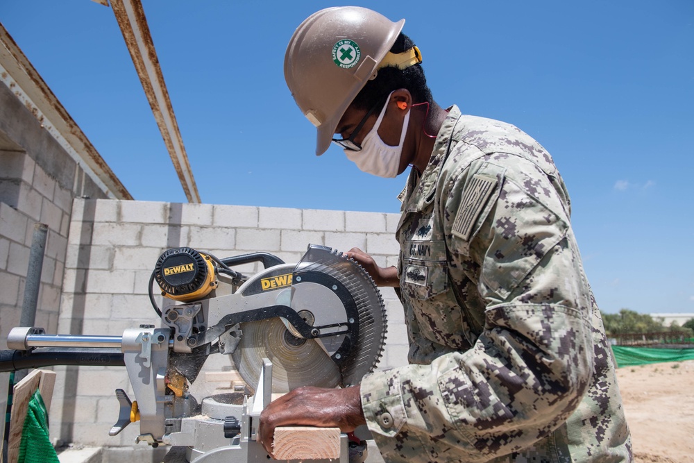 Seabees assigned to Naval Mobile Construction Battalion (NMCB) conduct a sewage line installation project for a kennel office building on board Naval Station Rota, Spain.