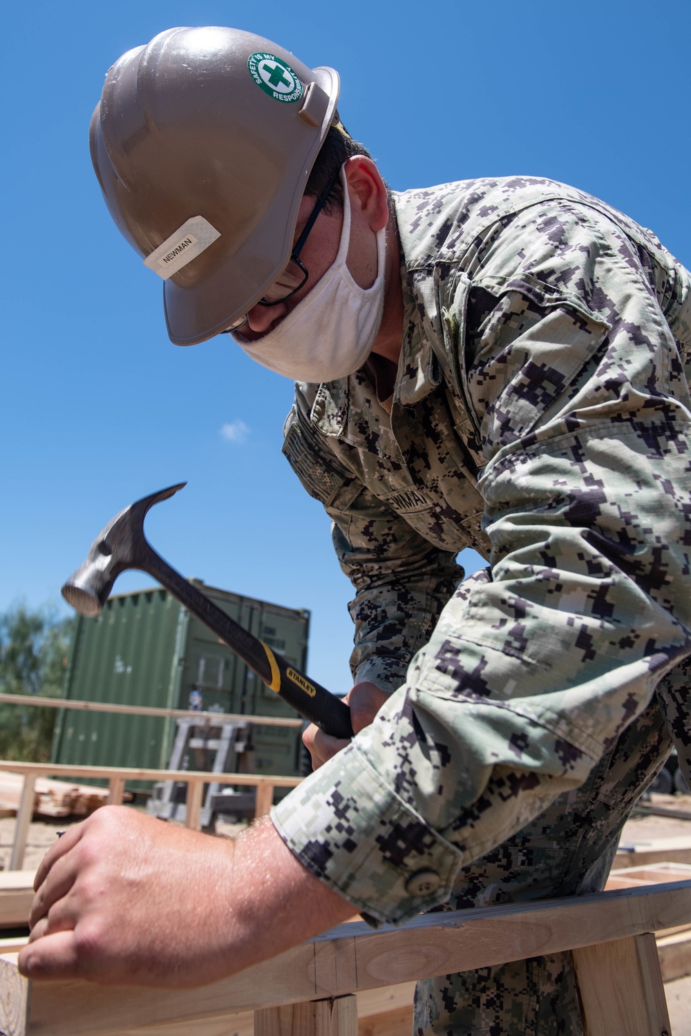 Seabees assigned to Naval Mobile Construction Battalion (NMCB) conduct a sewage line installation project for a kennel office building on board Naval Station Rota, Spain.