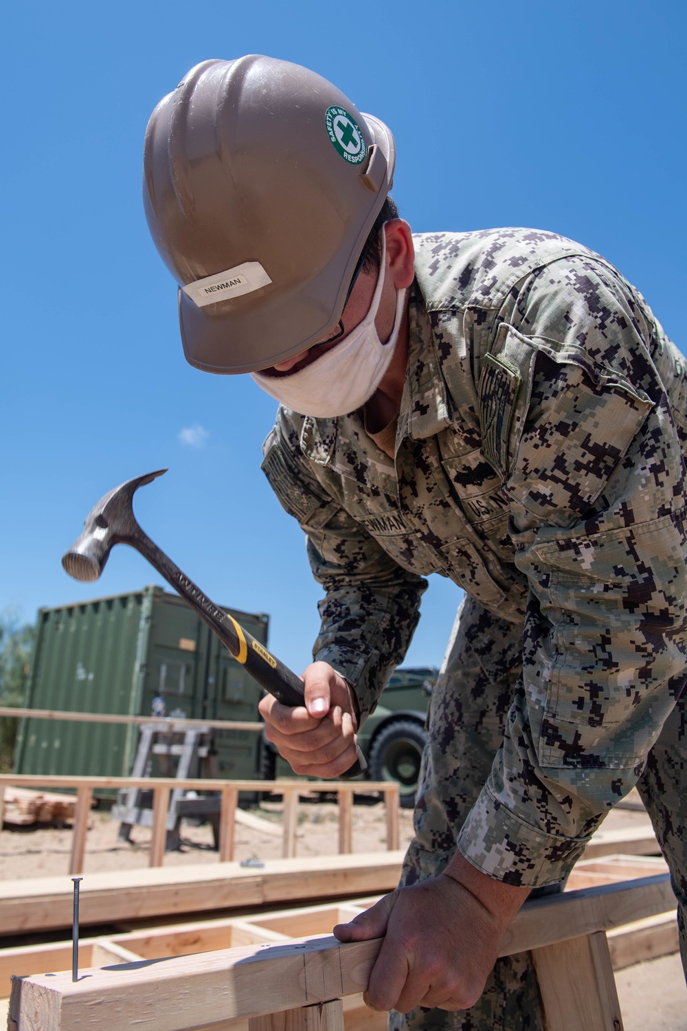 Seabees assigned to Naval Mobile Construction Battalion (NMCB) conduct a sewage line installation project for a kennel office building on board Naval Station Rota, Spain.