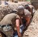 Seabees assigned to Naval Mobile Construction Battalion (NMCB) conduct a sewage line installation project for a kennel office building on board Naval Station Rota, Spain.