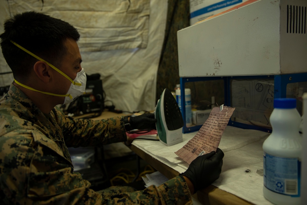 15th MEU MP’s scan for fingerprints after raid exercise