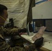 15th MEU MP’s scan for fingerprints after raid exercise