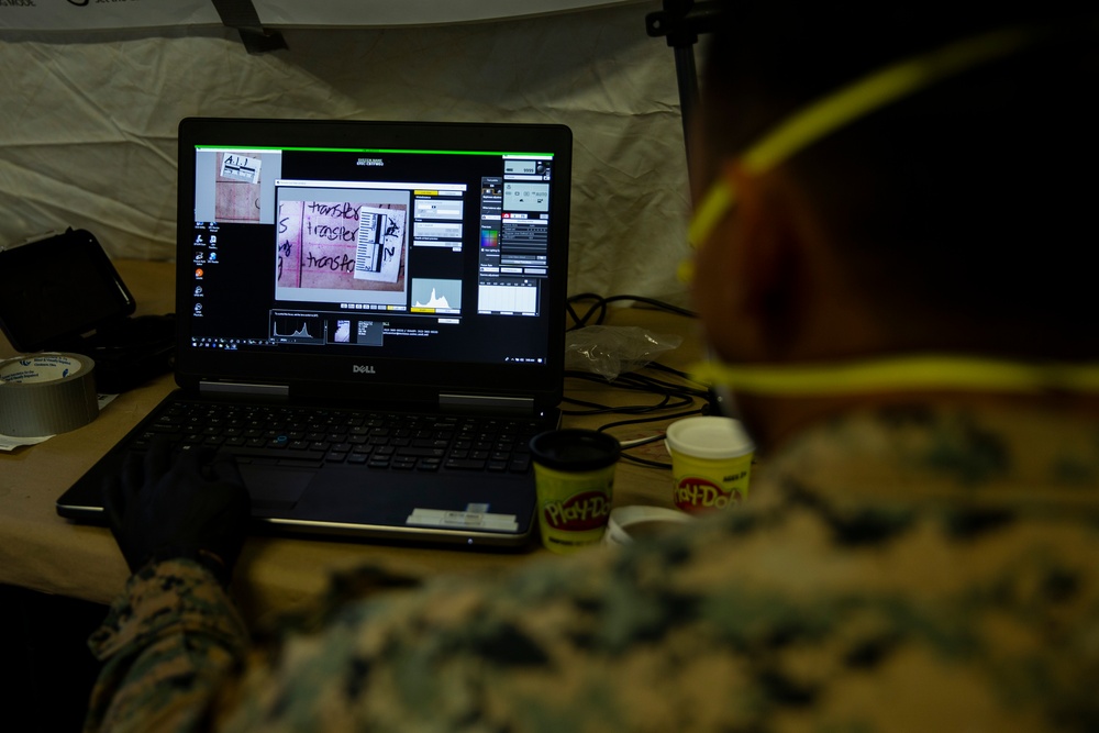 15th MEU MP’s scan for fingerprints after raid exercise