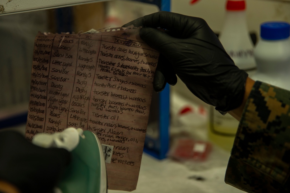 15th MEU MP’s scan for fingerprints after raid exercise