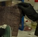 15th MEU MP’s scan for fingerprints after raid exercise
