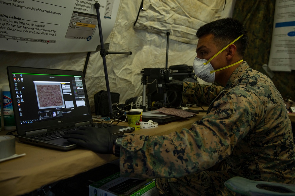 15th MEU MP’s scan for fingerprints after raid exercise
