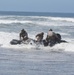 Reconnaissance and Explosive Ordnance Disposal Marines take the beach