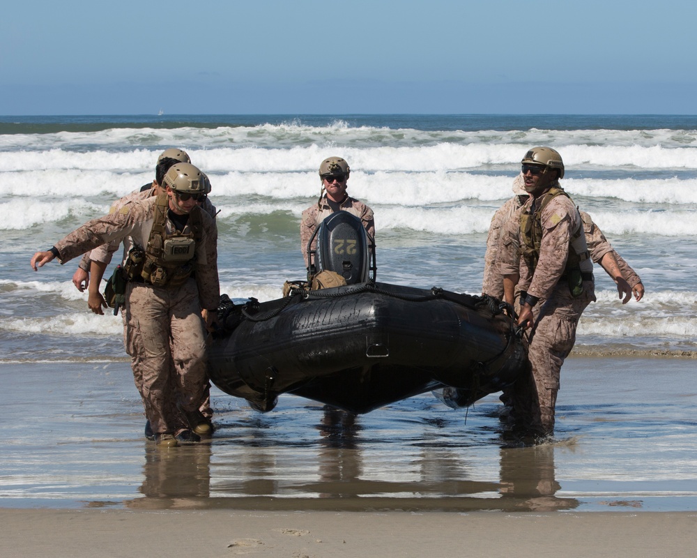 Reconnaissance and Explosive Ordnance Disposal Marines take the beach