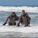 Reconnaissance and Explosive Ordnance Disposal Marines take the beach