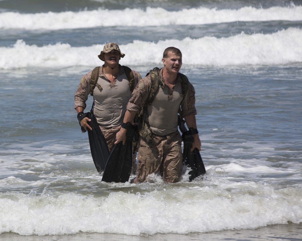 Reconnaissance and Explosive Ordnance Disposal Marines take the beach