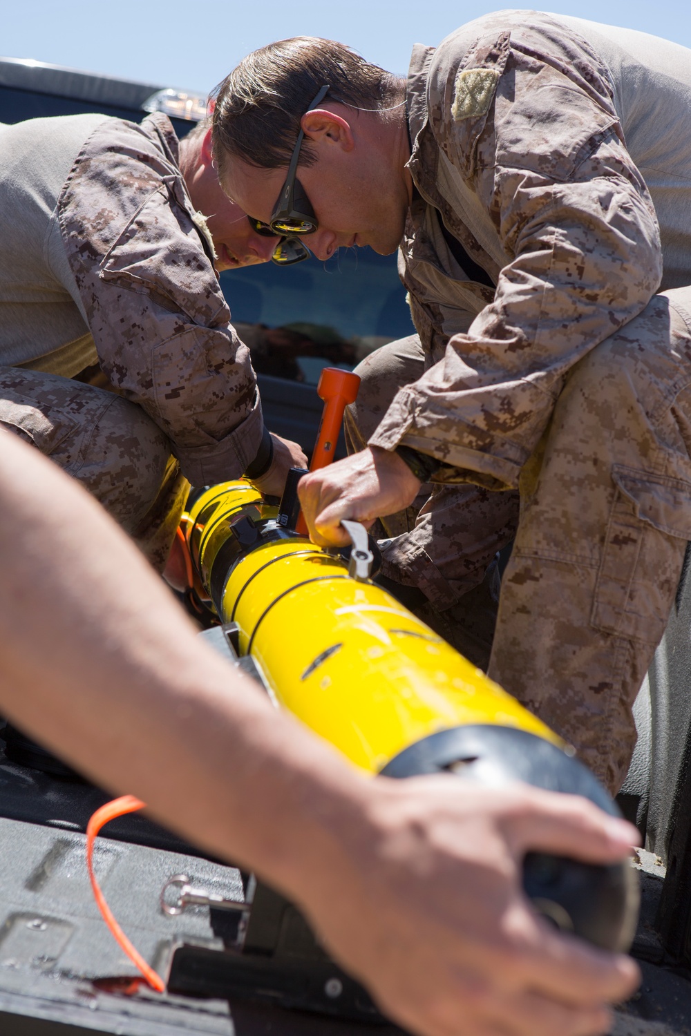 Reconnaissance and Explosive Ordnance Disposal Marines take the beach