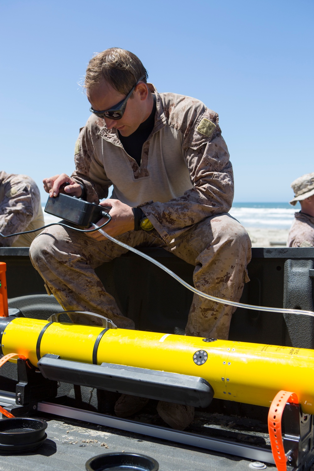 Reconnaissance and Explosive Ordnance Disposal Marines take the beach