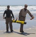 Reconnaissance and Explosive Ordnance Disposal Marines take the beach