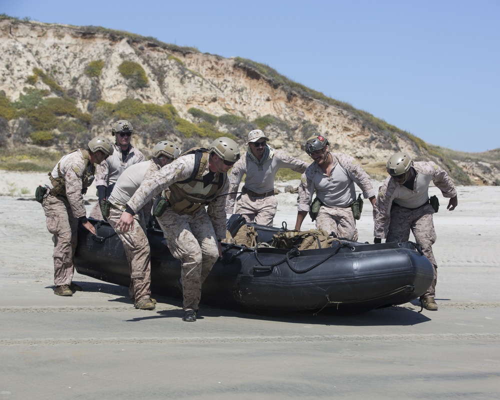 Reconnaissance and Explosive Ordnance Disposal Marines take the beach