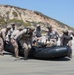 Reconnaissance and Explosive Ordnance Disposal Marines take the beach