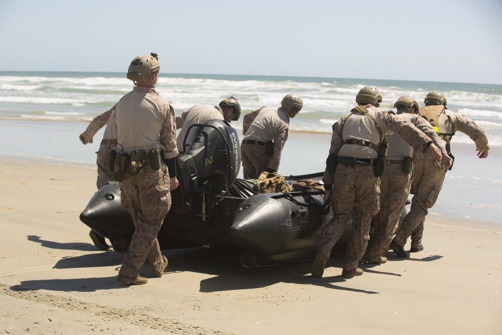 Reconnaissance and Explosive Ordnance Disposal Marines take the beach