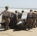 Reconnaissance and Explosive Ordnance Disposal Marines take the beach