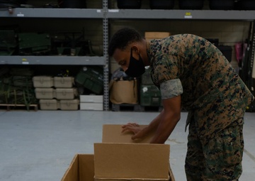 Keep it safe | U.S. Marines with CLR-37 store communications gear for safe-keeping