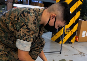Keep it safe | U.S. Marines with CLR-37 store communications gear for safe-keeping