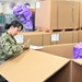 Naval Supply System Command Fleet Logistic Center Pearl Harbor prepares tri-wall postal packages for the Nimitz Carrier Strike Group