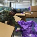 Naval Supply System Command Fleet Logistic Center Pearl Harbor prepares tri-wall postal packages for the Nimitz Carrier Strike Group