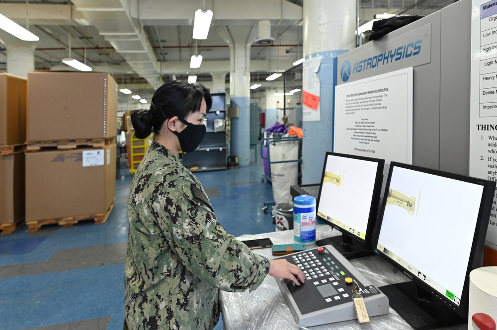 Naval Supply System Command Fleet Logistic Center Pearl Harbor prepares tri-wall postal packages for the Nimitz Carrier Strike Group