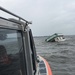 Coast Guard rescues 2 people, 1 cat from sinking houseboat
