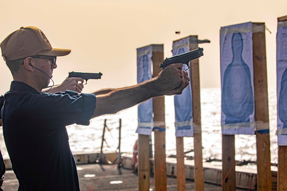 Sailors take part in a weapons qualification