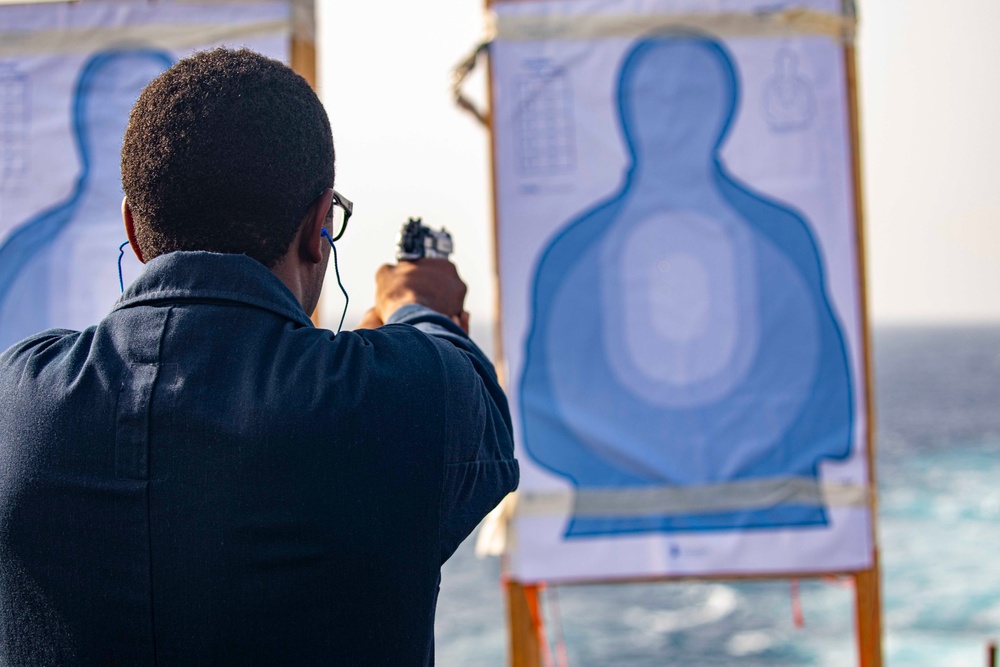 Sailors take part in a weapons qualification