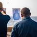 Sailors take part in a weapons qualification