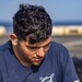 Sailors take part in a weapons qualification