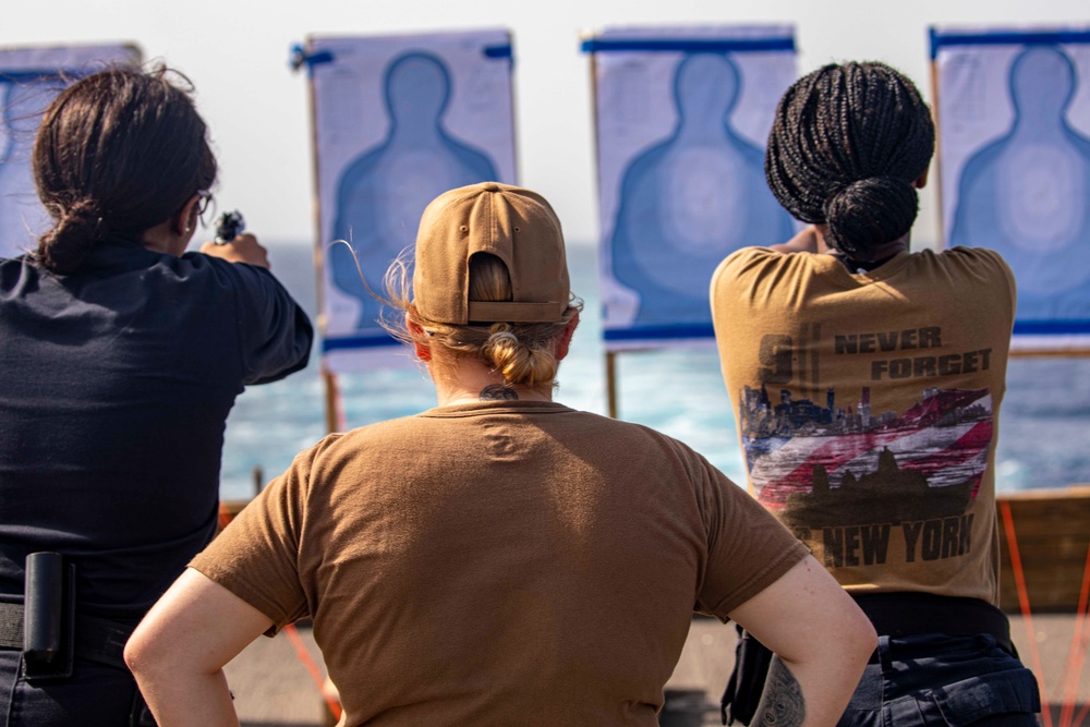 Sailors take part in a weapons qualification