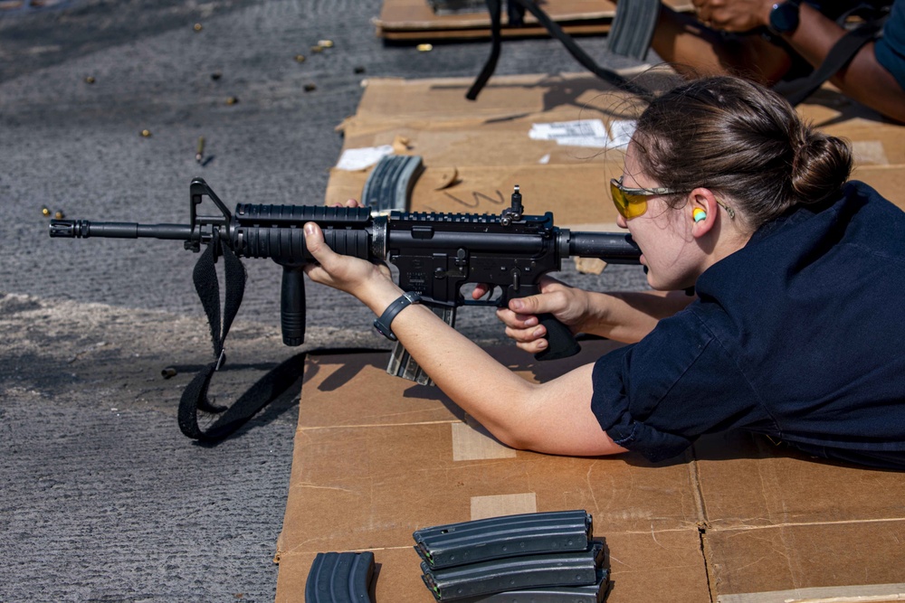 Sailors take part in a weapons qualification